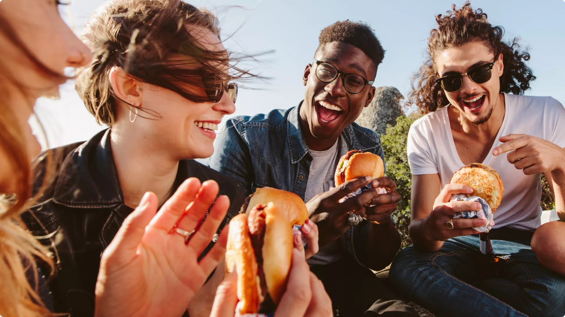 Friends sharing a meal, choosing where to spend their time and attention
